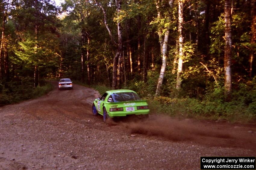 Jim Dale / Bob Logue Mazda RX-7 trails the Seamus Burke / Tom Lawless Mitsubishi Galant VR-4 on SS1, Akeley Cutoff.