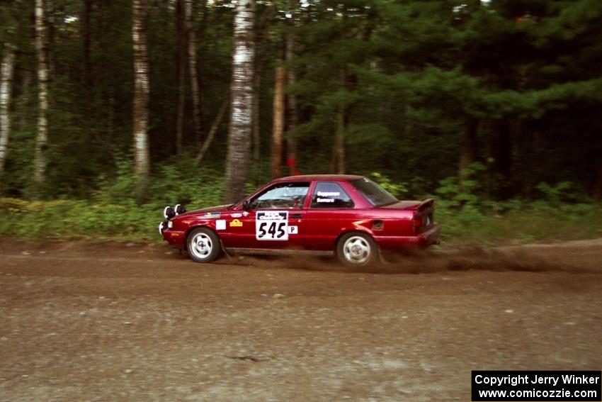 Eric Seppanen / Chris Somero Nissan Sentra SE-R at speed on SS1, Akeley Cutoff.