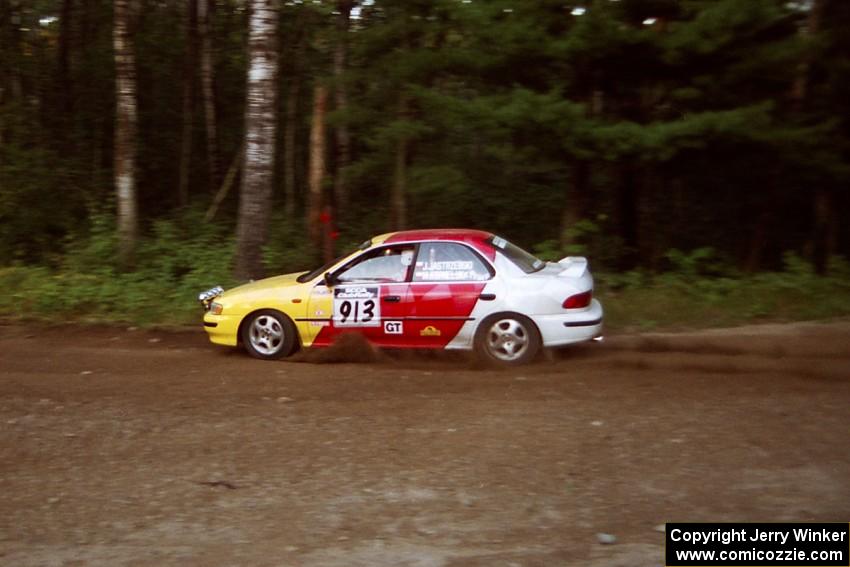 Janusz Jastrzebski / Kathy Freund Subaru Impreza at speed on SS1, Akeley Cutoff.