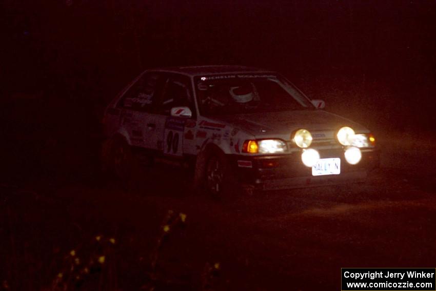 Lauchlin O'Sullivan / John Dillon Mazda 323GTX at speed through the crossroads on SS6, East Steamboat.