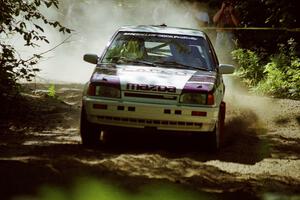 Gail Truess / Pattie Hughes Mazda 323GTX at the spectator location on SS9, Strawberry Mountain.