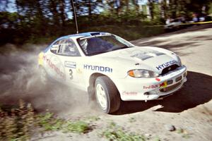 Paul Choiniere / Jeff Becker Hyundai Tiburon powers out of a corner on SS11, Anchor Hill.