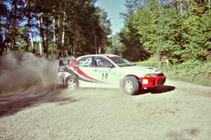 Garen Shrader / Doc Schrader Mitsubishi Lancer Evo IV powers out of a corner on SS11, Anchor Hill.