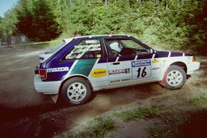 Gail Truess / Pattie Hughes Mazda 323GTX powers out of a corner on SS11, Anchor Hill.