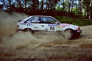 Lauchlin O'Sullivan / John Dillon Mazda 323GTX comes into a corner too hot on SS11, Anchor Hill.