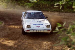 Ted Grzelak / Chris Plante Mazda RX-7 powers out of a corner on SS11, Anchor Hill.