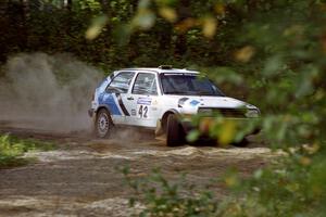 Eric Burmeister / Mark Buskirk VW GTI powers out of a corner on SS11, Anchor Hill.