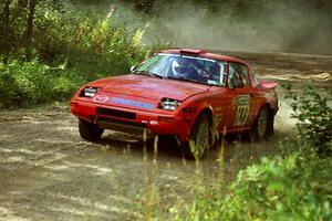 Andrew Havas / Scott Slingerland Mazda RX-7 powers out of a corner on SS11, Anchor Hill.