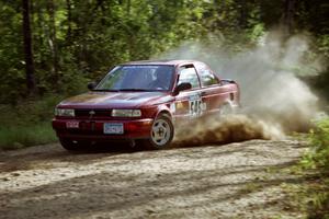 Eric Seppanen / Chris Somero Nissan Sentra SE-R at speed on SS11, Anchor Hill.