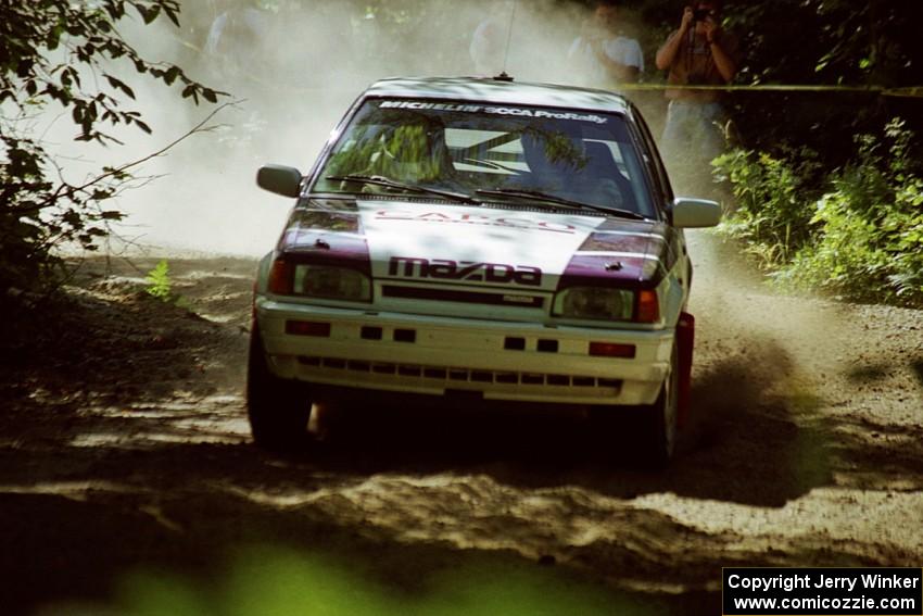 Gail Truess / Pattie Hughes Mazda 323GTX at the spectator location on SS9, Strawberry Mountain.