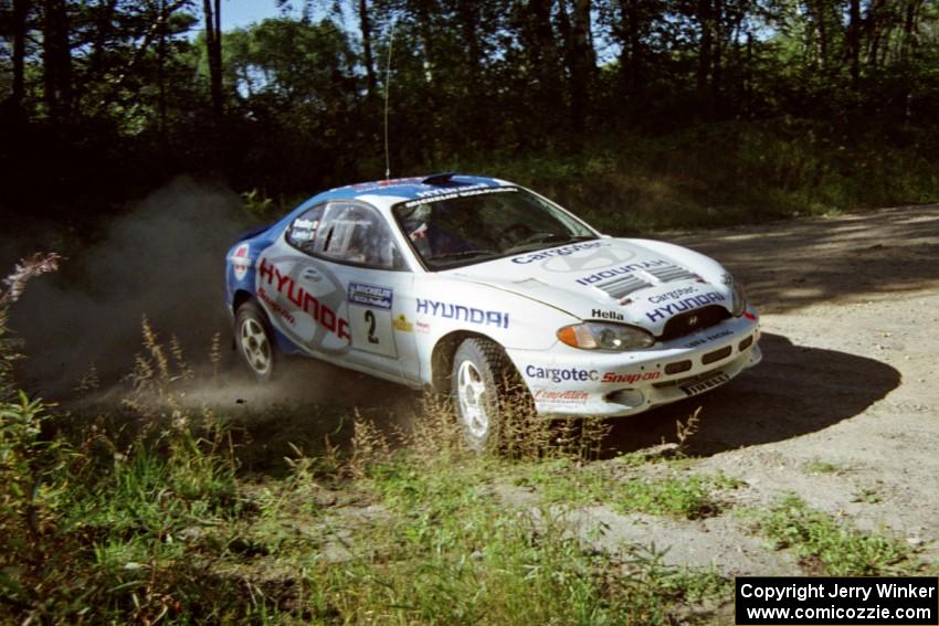 Noel Lawler / Charles Bradley Hyundai Tiburon powers out of a corner on SS11, Anchor Hill.