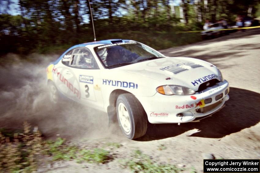 Paul Choiniere / Jeff Becker Hyundai Tiburon powers out of a corner on SS11, Anchor Hill.