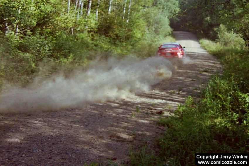 Ralph Kosmides / Joe Noyes Toyota Supra Turbo at speed on a straight on SS11, Anchor Hill.