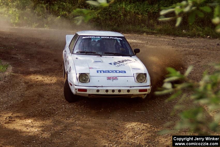 Ted Grzelak / Chris Plante Mazda RX-7 powers out of a corner on SS11, Anchor Hill.
