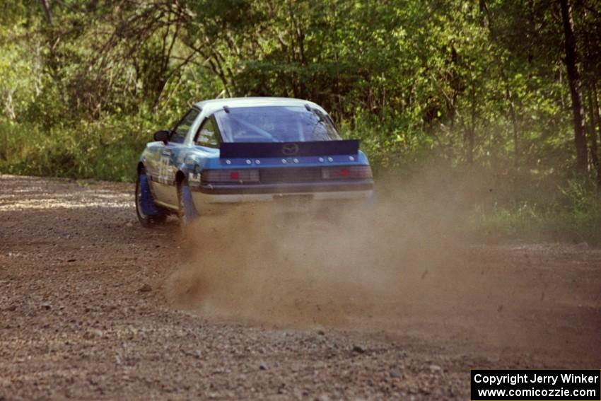 Mike Hurst / Rob Bohn Mazda RX-7 at speed on SS11, Anchor Hill.