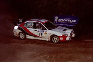 Garen Shrader / Doc Schrader Mitsubishi Lancer Evo IV comes through the spectator corner on SS14, Perkins Road.