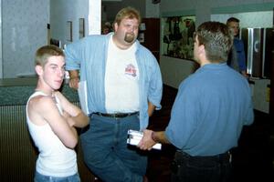 Micah Erickson, Todd Erickson, Norm Johnson have a discussion in the front foyer of the Northland Inn