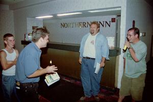Micah Erickson, Todd Erickson, Norm Johnson and Jesse Mullan joking around in the front foyer of the Northland Inn