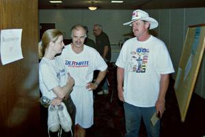 Diane Sargent, Dave Fuss and Mike Halley discuss the rally at the banquet