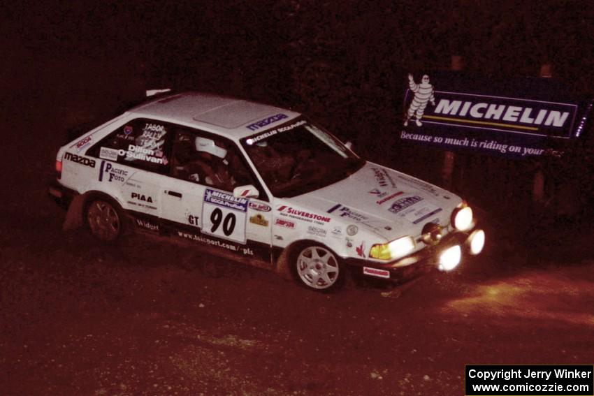 Lauchlin O'Sullivan / John Dillon Mazda 323GTX comes through the spectator corner on SS14, Perkins Road.