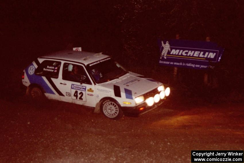 Eric Burmeister / Mark Buskirk VW GTI comes through the spectator corner on SS14, Perkins Road.