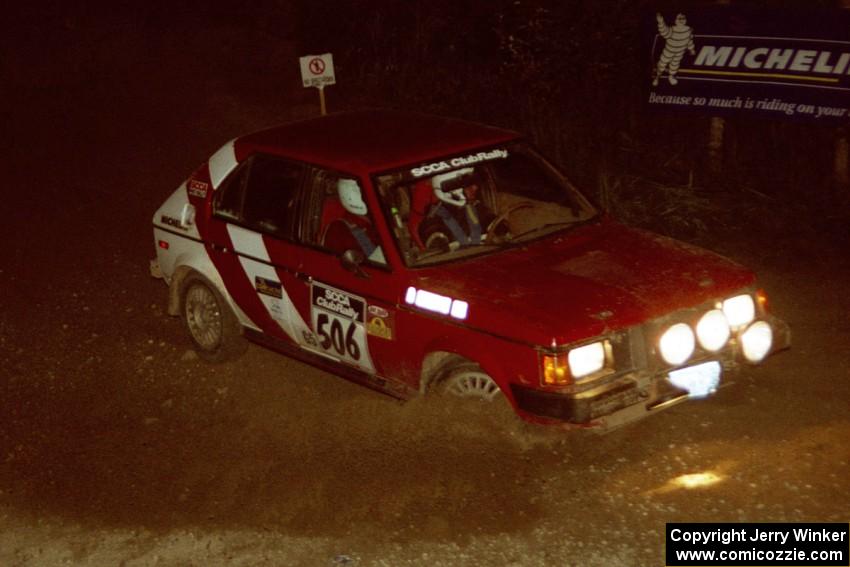 Erik Payeur / Adam Payeur Dodge Omni comes through the spectator corner on SS14, Perkins Road.