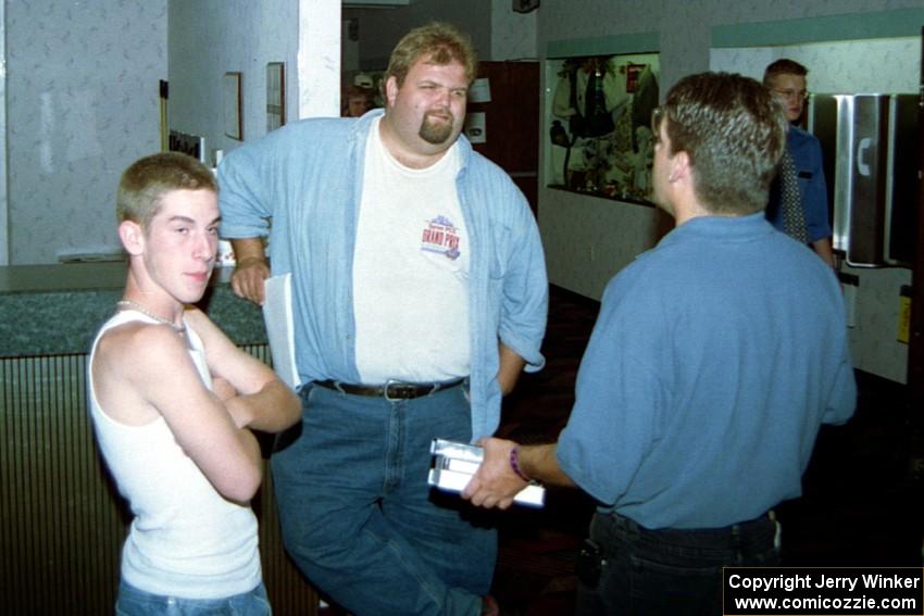 Micah Erickson, Todd Erickson, Norm Johnson have a discussion in the front foyer of the Northland Inn