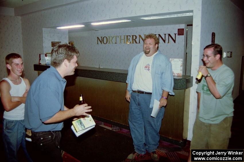 Micah Erickson, Todd Erickson, Norm Johnson and Jesse Mullan joking around in the front foyer of the Northland Inn