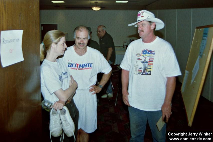 Diane Sargent, Dave Fuss and Mike Halley discuss the rally at the banquet