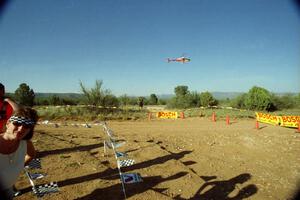 A helicopter hovers over the spectator corner on SS8, Limestone I.