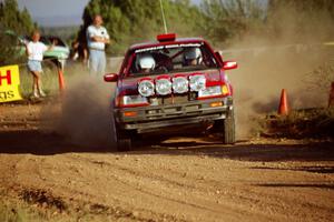 Doug Robinson / Sue Robinson Mazda 323GTX at the spectator corner on SS8, Limestone I.