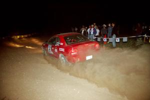 Trevor Donison / John Allen Plymouth Neon at the spectator corner on SS9, Limestone II.