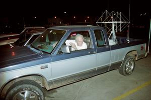 A worker is serious about having good radio reception at the Prescott Forest Rally