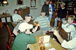 Workers relax at the victory celebration in the bar