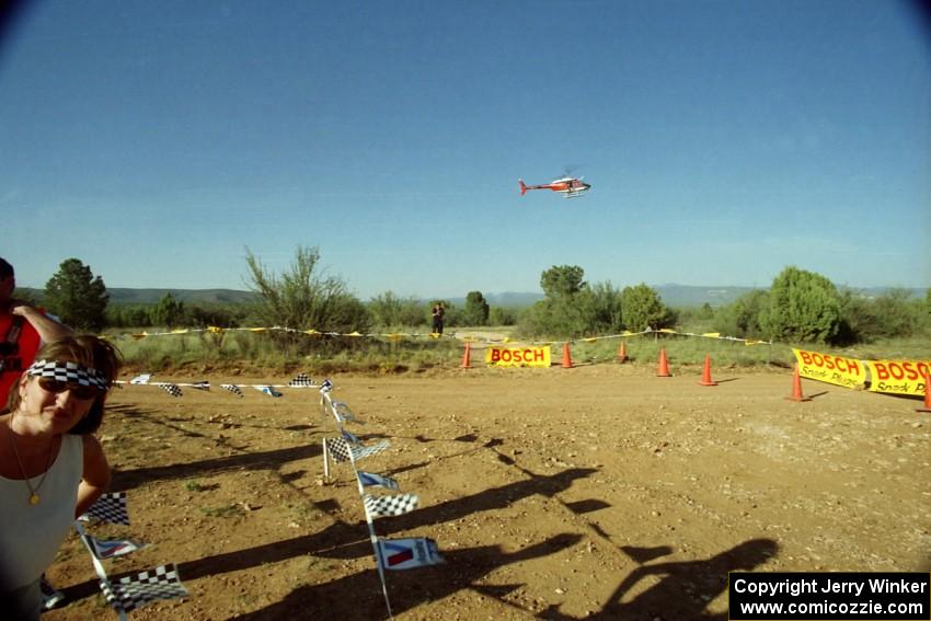 A helicopter hovers over the spectator corner on SS8, Limestone I.