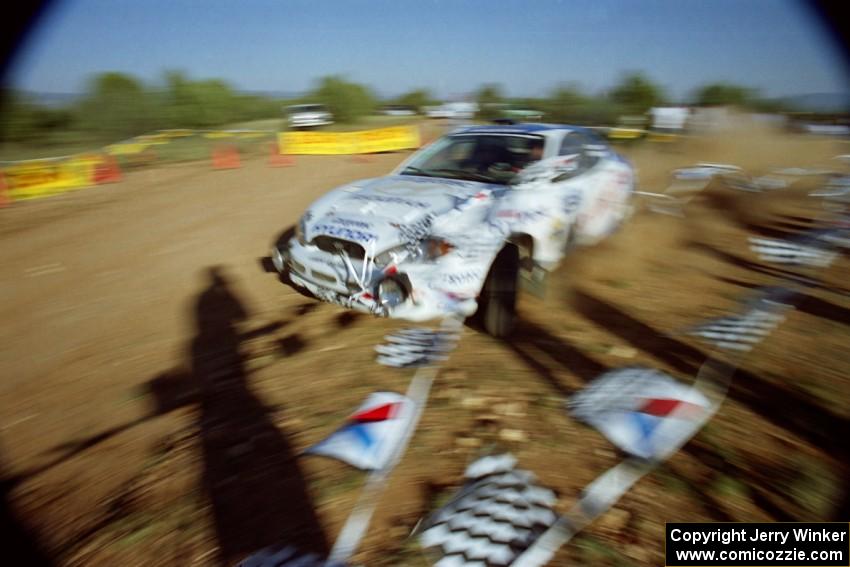 Noel Lawler / Charles Bradley Hyundai Tiburon rips up the inside banner and post at the spectator corner on SS8, Limestone I.