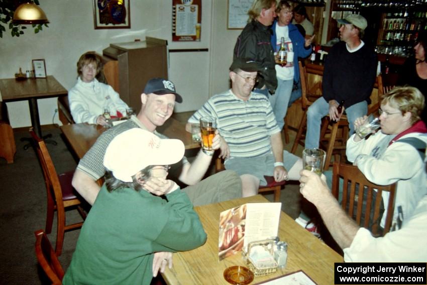 Workers relax at the victory celebration in the bar