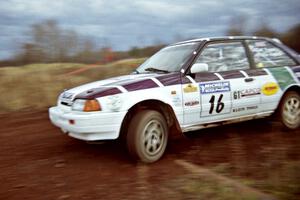 Gail Truess / Pattie Hughes Mazda 323GTX at speed on the practice stage.