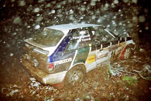 Gail Truess / Pattie Hughes Mazda 323GTX crashed heavily into a tree at the flying finish of SS5, Passmore.