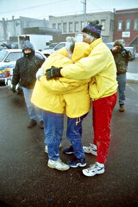 Mark Utecht, Brenda Corneliusen and Al Kintigh perform a group hug to stay warm at parc expose in Calumet on day two.