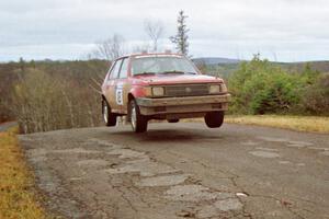 Mark Utecht / Diane Sargent Dodge Omni GLH-Turbo at the final yump on SS14, Brockway Mountain I.