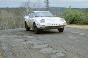 Ted Grzelak / Chris Plante Mazda RX-7 at the final yump on SS14, Brockway Mountain I.