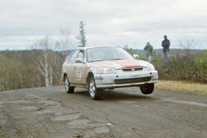 Jay Kowalik / Tom Tighe Honda Civic at the final yump on SS14, Brockway Mountain I.