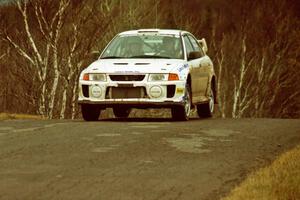 Karl Scheible / Gail McGuire Mitsubishi Lancer Evo V at the final yump on SS14, Brockway Mountain I.