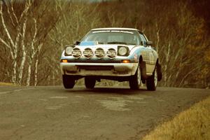 Mike Hurst / Rob Bohn Mazda RX-7 at the final yump on SS14, Brockway Mountain I.