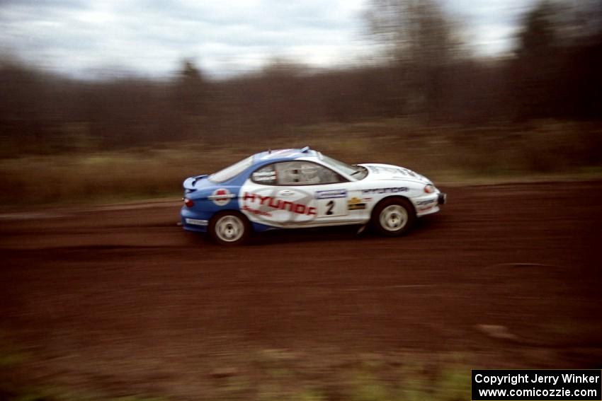 Noel Lawler / Charles Bradley Hyundai Tiburon at speed on the practice stage.