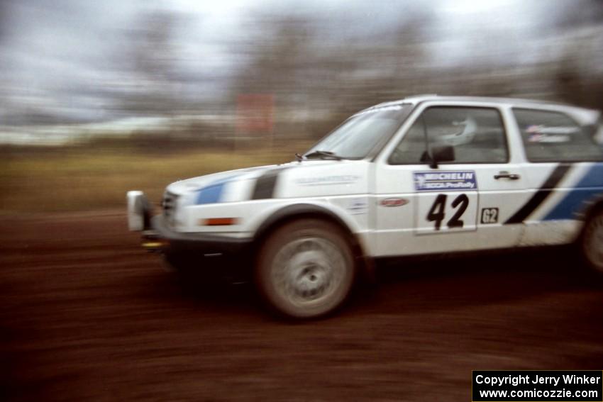 Eric Burmeister / Mark Buskirk VW GTI at speed on the practice stage.