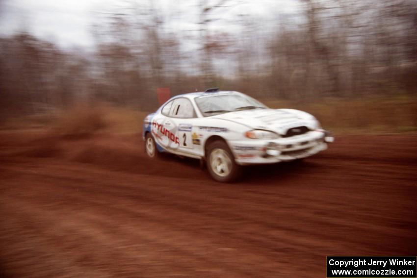 Noel Lawler / Charles Bradley Hyundai Tiburon at speed on the practice stage.