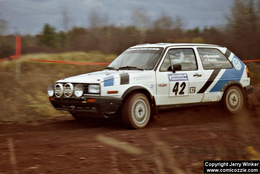 Eric Burmeister / Mark Buskirk VW GTI at speed on the practice stage.