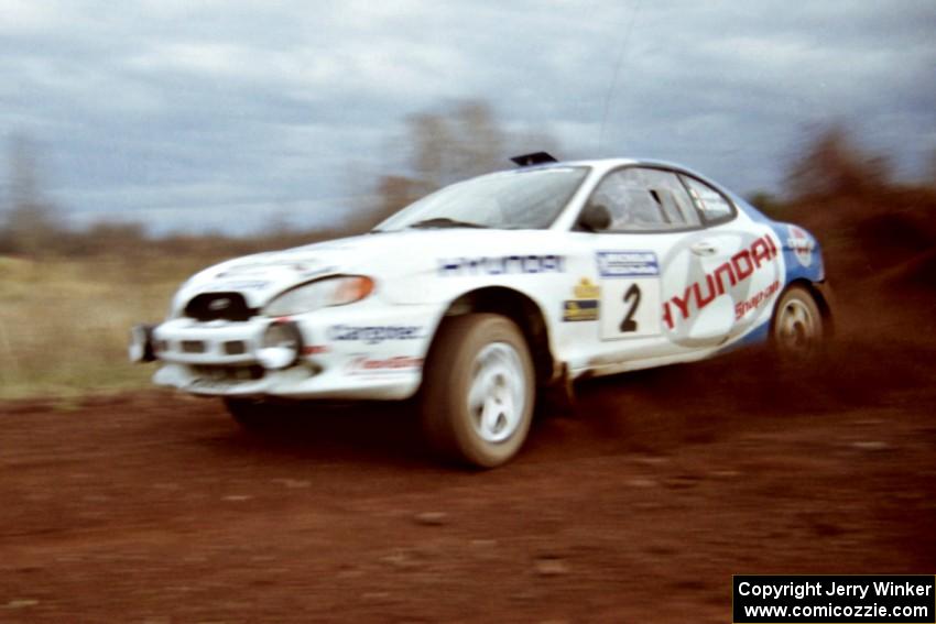 Noel Lawler / Charles Bradley Hyundai Tiburon at speed on the practice stage.